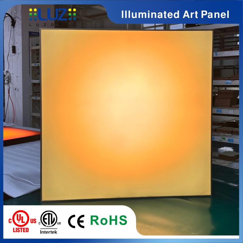 Twilight eclipse backlit acrylic wall sconce turned on radiating warm amber halo ambient glow