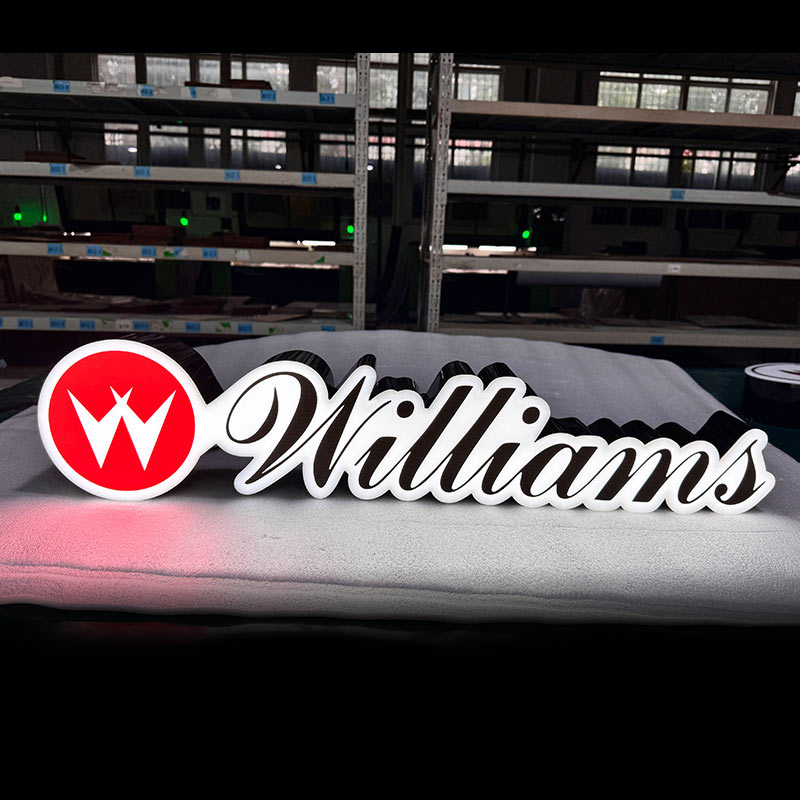 Williams custom LED acrylic logo sign with black base structure, white script lettering on red circle W logo